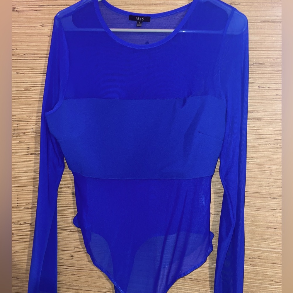 Woman’s royal blue body suit